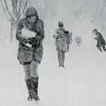 students walking on the quad in blizzard conditions