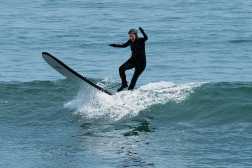 Barbara Caron, editor-in-chief learning how to surf