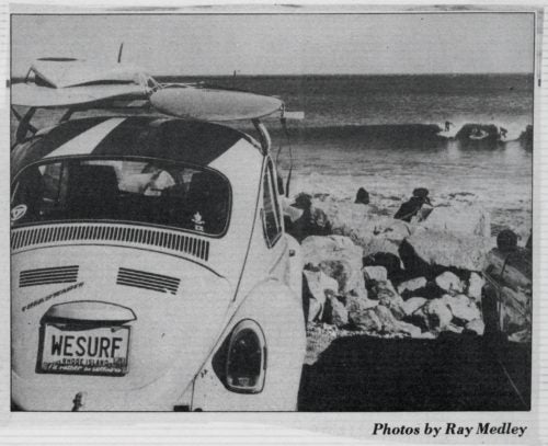 Pan's Volkswagen Beetle—which doubled as a board caddy—at Monahan's dock with Pan out on the waves.