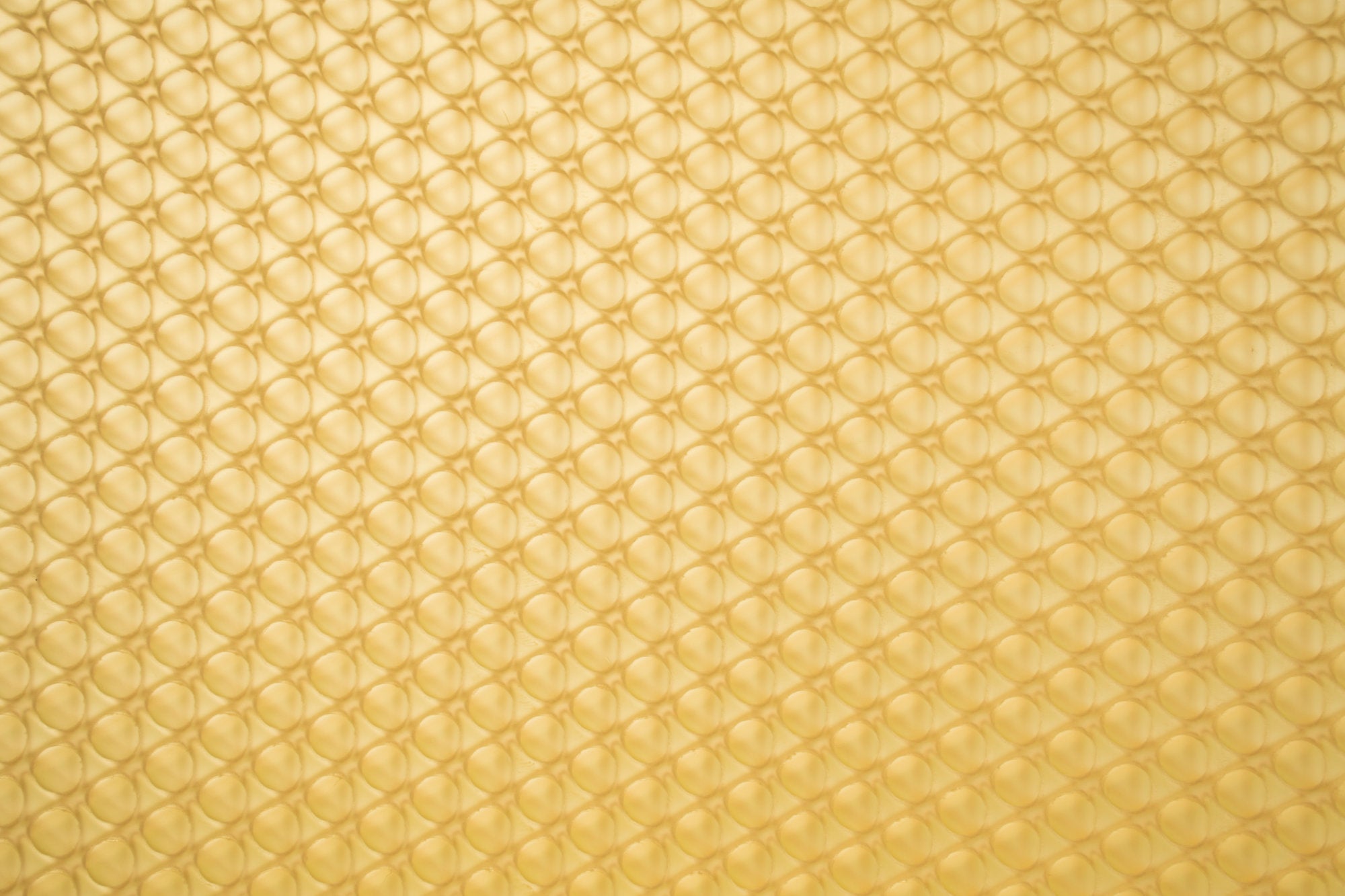 A detail of a gold colored lighting panel in the Fascitelli Center for Advanced Engineering