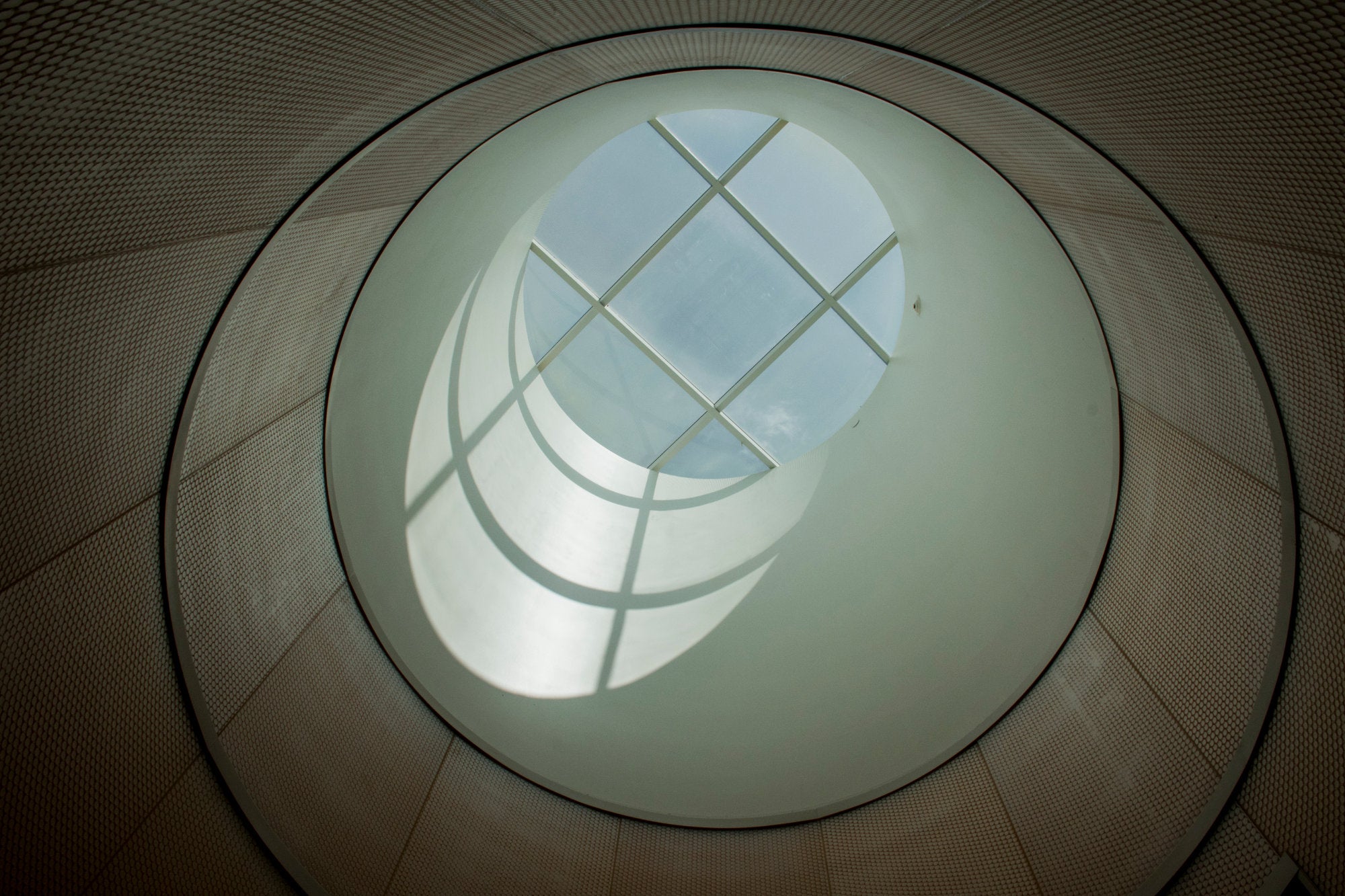 A distinctive oculus allows natural light to enter the building.