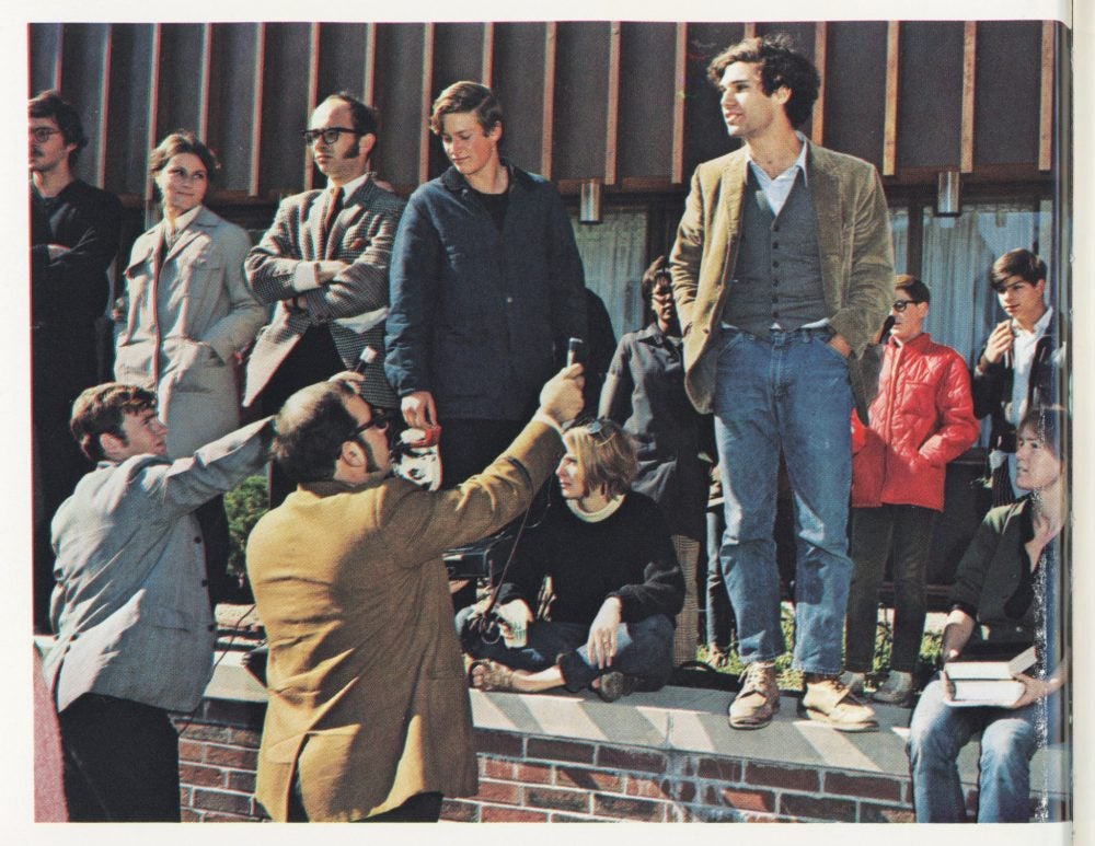 A yearbook photo showing students being interviewed by reporters