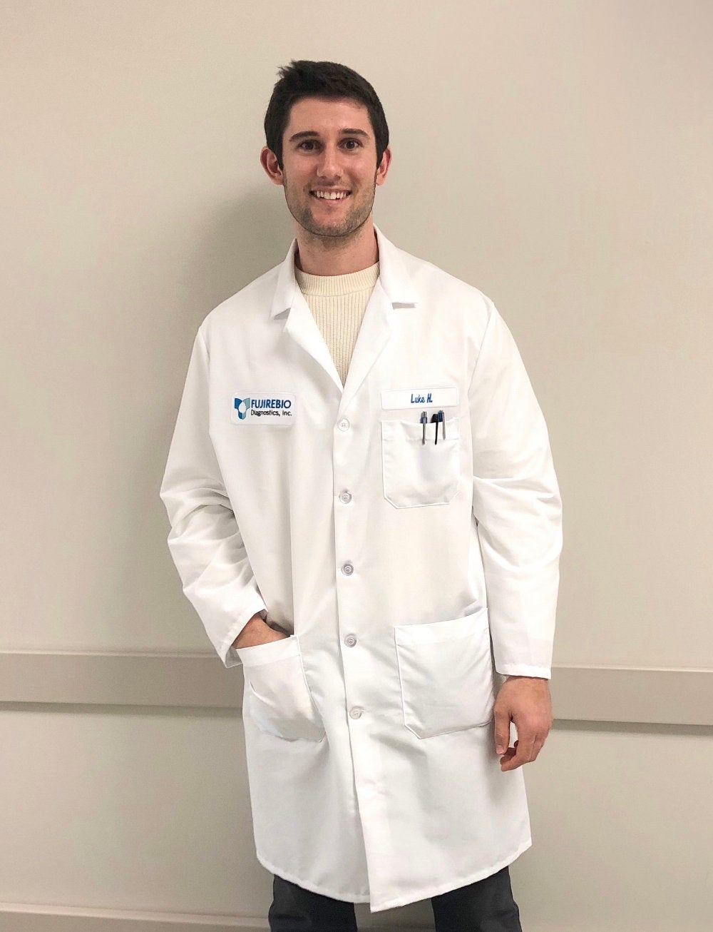 Luke Hayden wearing a lab coat