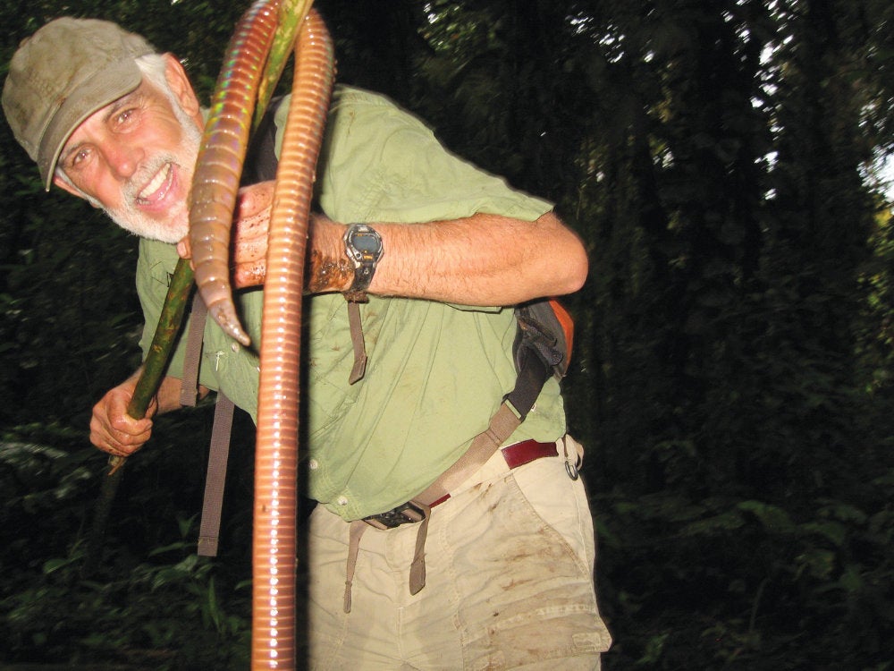 Stephen Hopkins holding a giant Sumaco earthworm