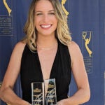Alyssa Botelho, a 2021 graduate, holds her award for Best Director and Best Short Film Emmys for “To Dust All Return."