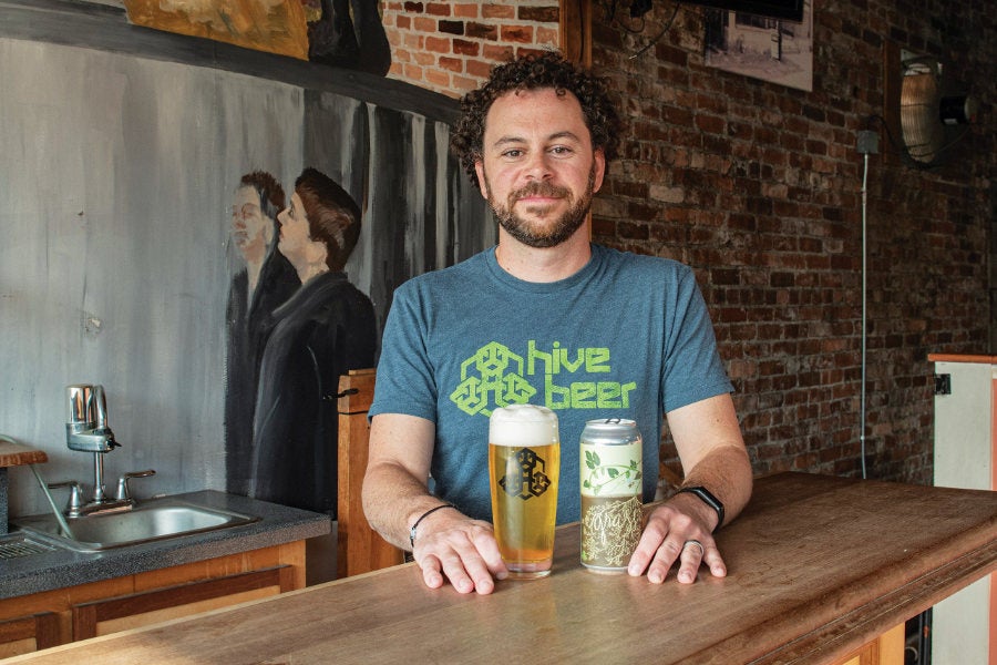 Kevin Clark ’08 at Grey Sail Brewing in Westerly, R.I., where he brews Hive Beer.