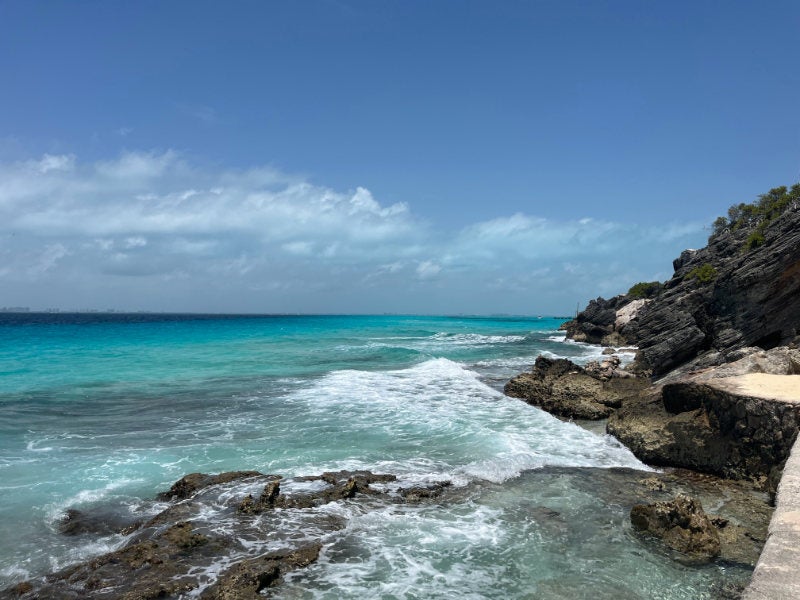 Rolling waves next to a coastal walking path, Isla Mujeres, Mexico