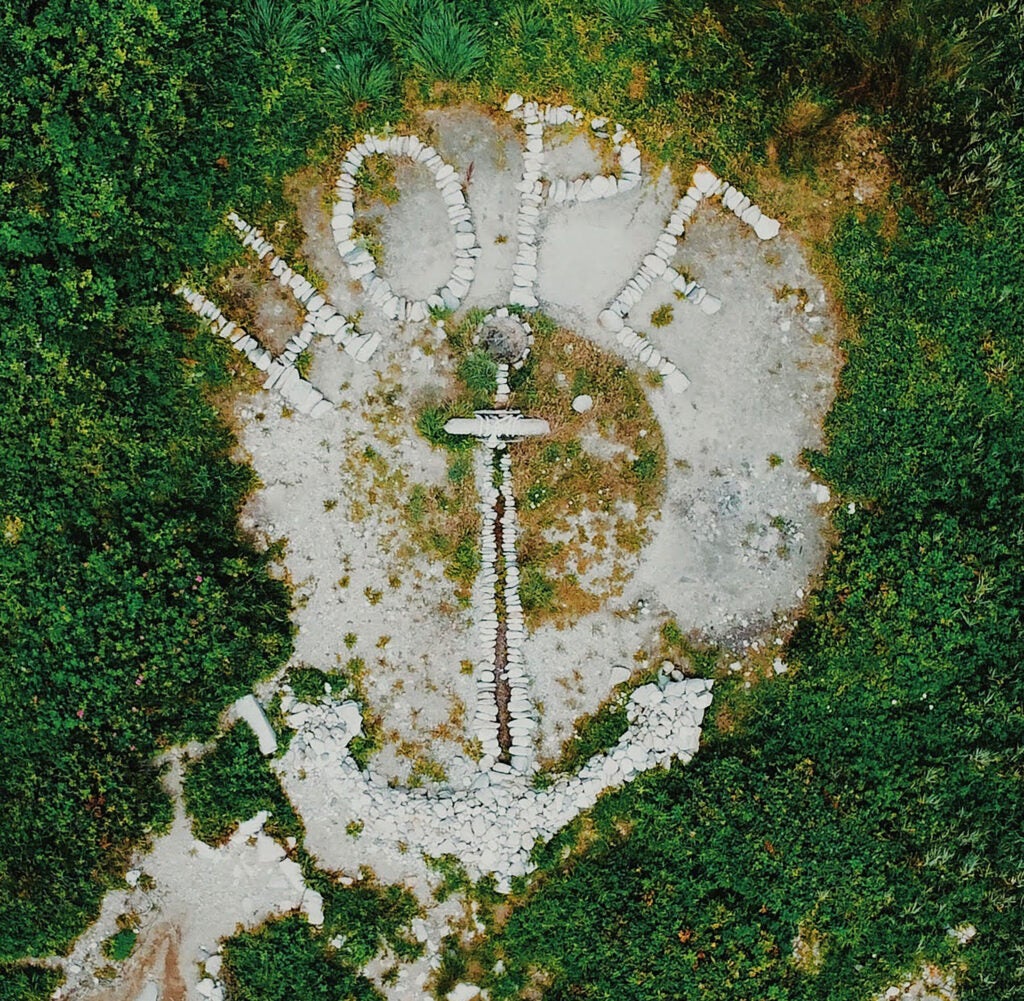 View from above of the word "HOPE" and an anchor, reminiscent of the Rhode Island state flag