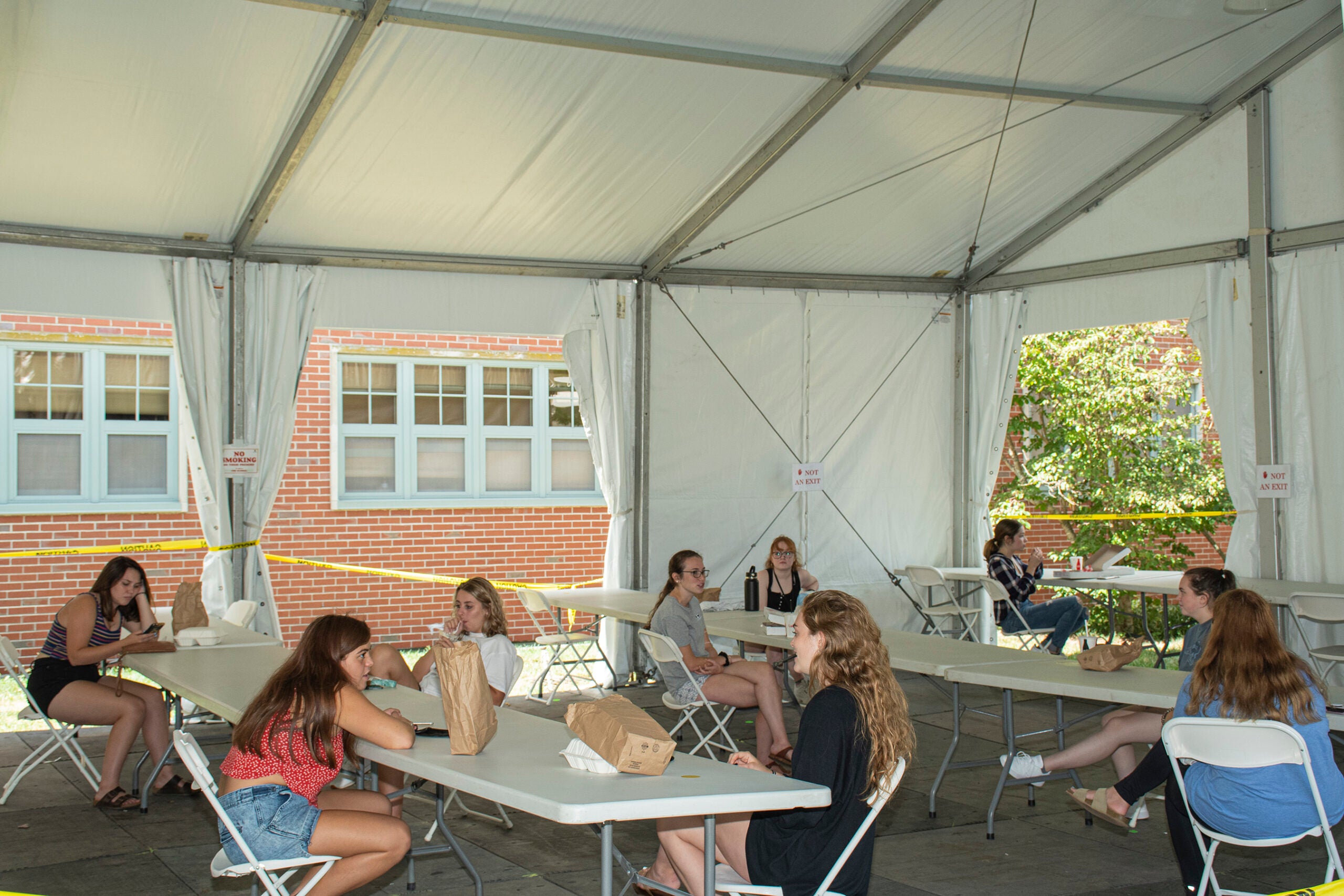 Students dine outside in tents