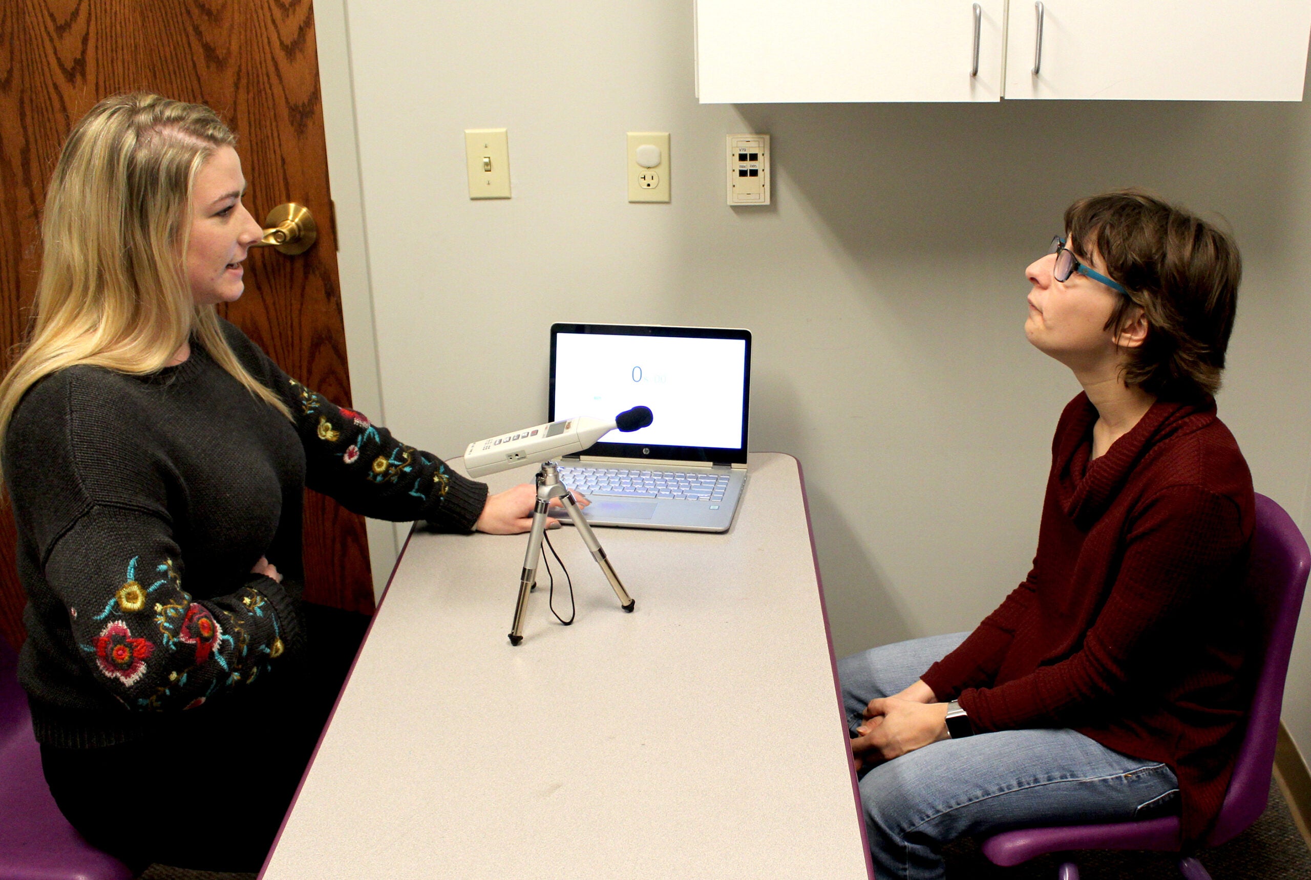 Speech pathology graduate student Erin Blanchette works with Rachel Ferreira