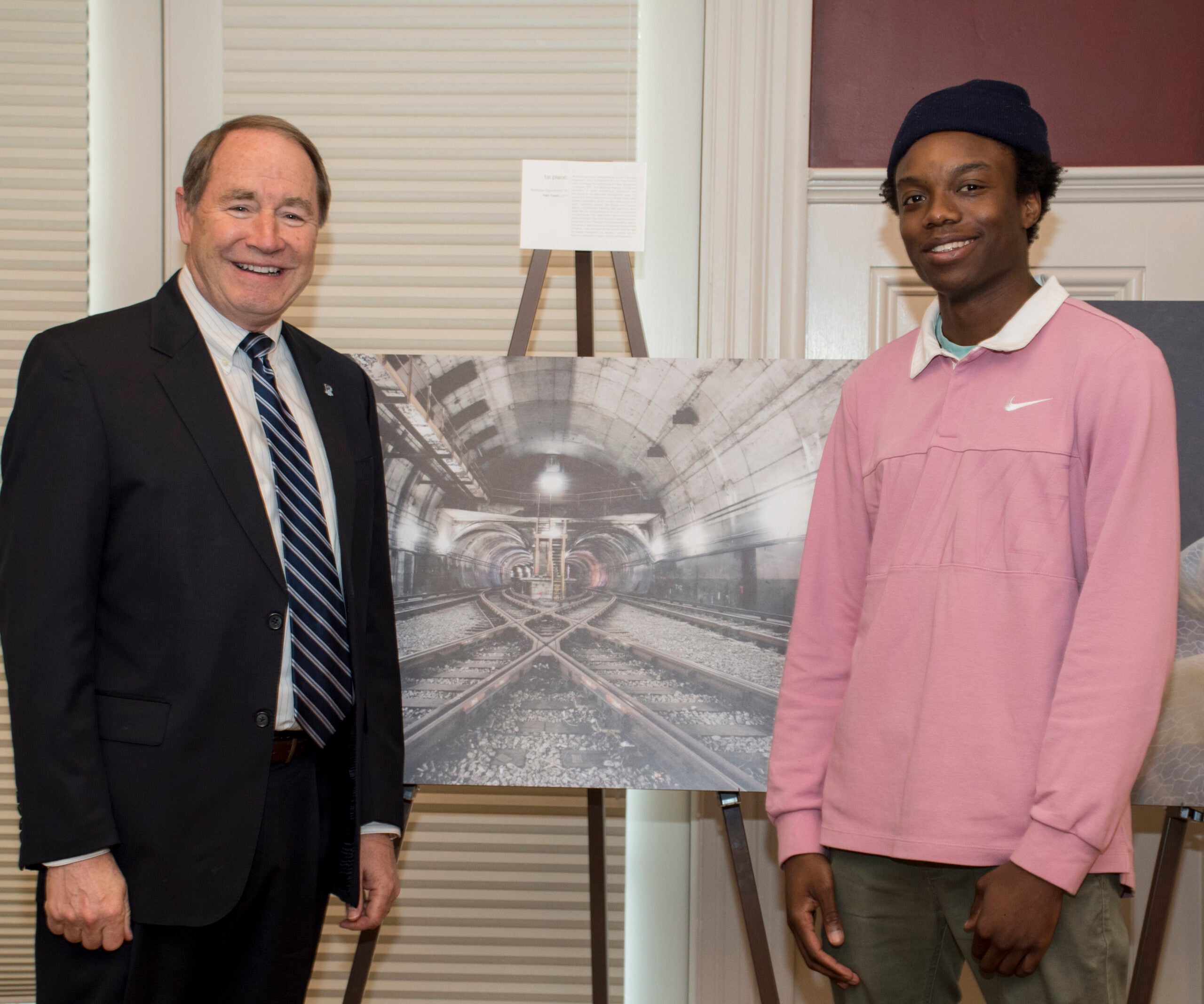 URI President David M. Dooley poses with Temitope Ogunwumi