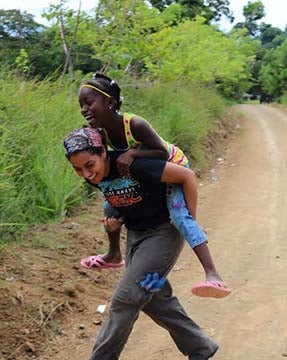 Malloy playing with one of the villagers during downtime. Photo courtesy of Elizabeth Malloy