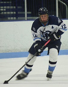 Cameron Schneck in action from his playing days with the Rhody hockey team. Photo courtesy Cameron Schneck.