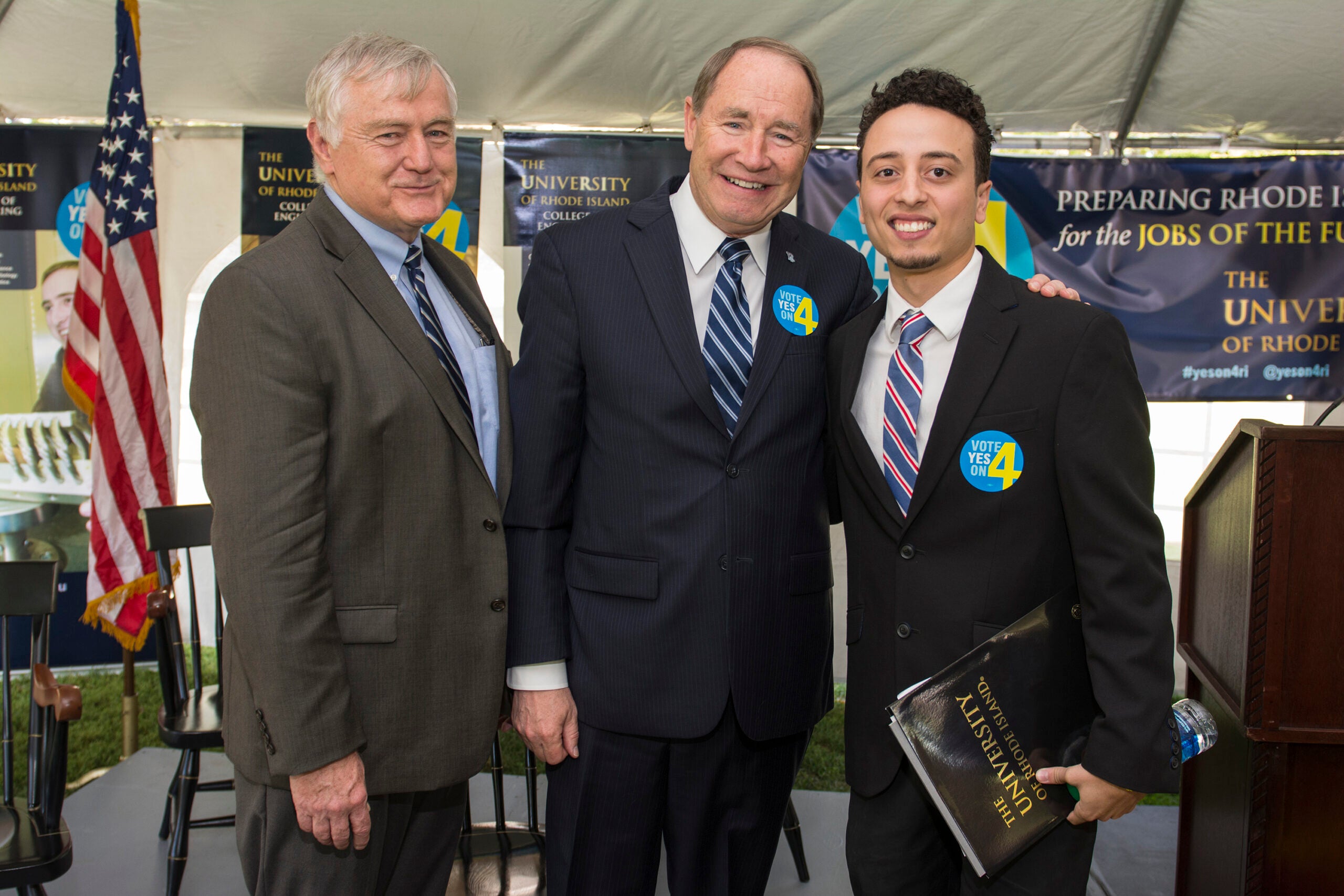 From left, URI Engineering Dean Raymond M. Wright, URI President David M Dooley and URI engineering student Anthony Rodriguez are all smiles after the "Vote Yes on 4" campaign launch today at URI. Photo by Nora Lewis