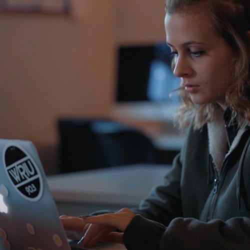 a student using her laptop