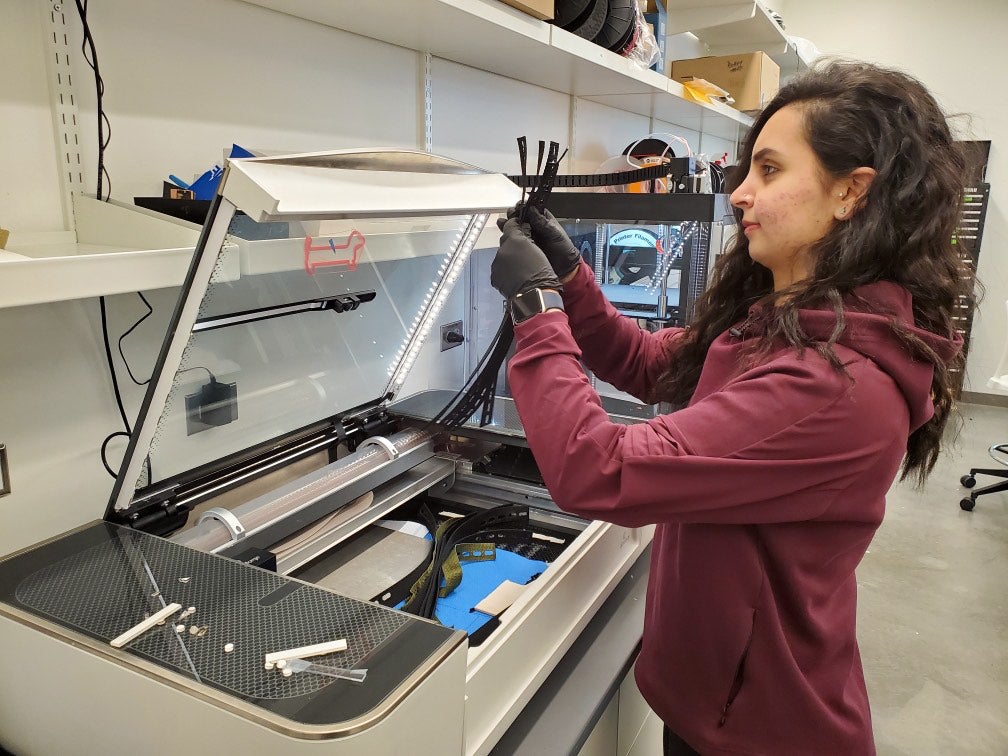Afnan Altekreeti works on one of the 3-D printers