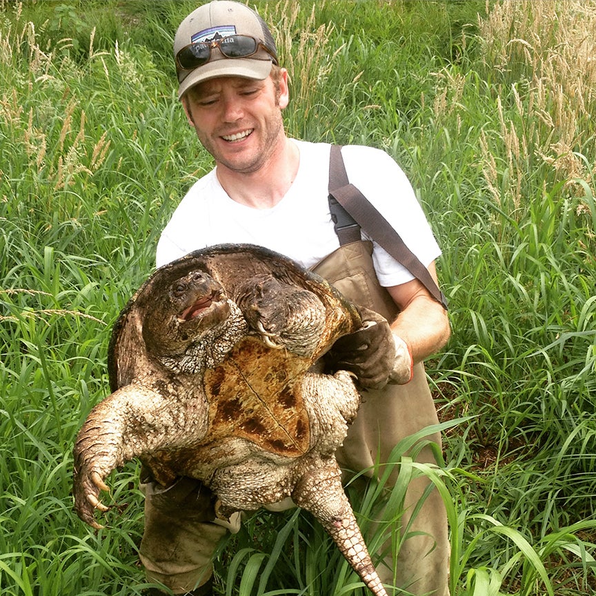 Scott Buchanan handles a snapping turtle