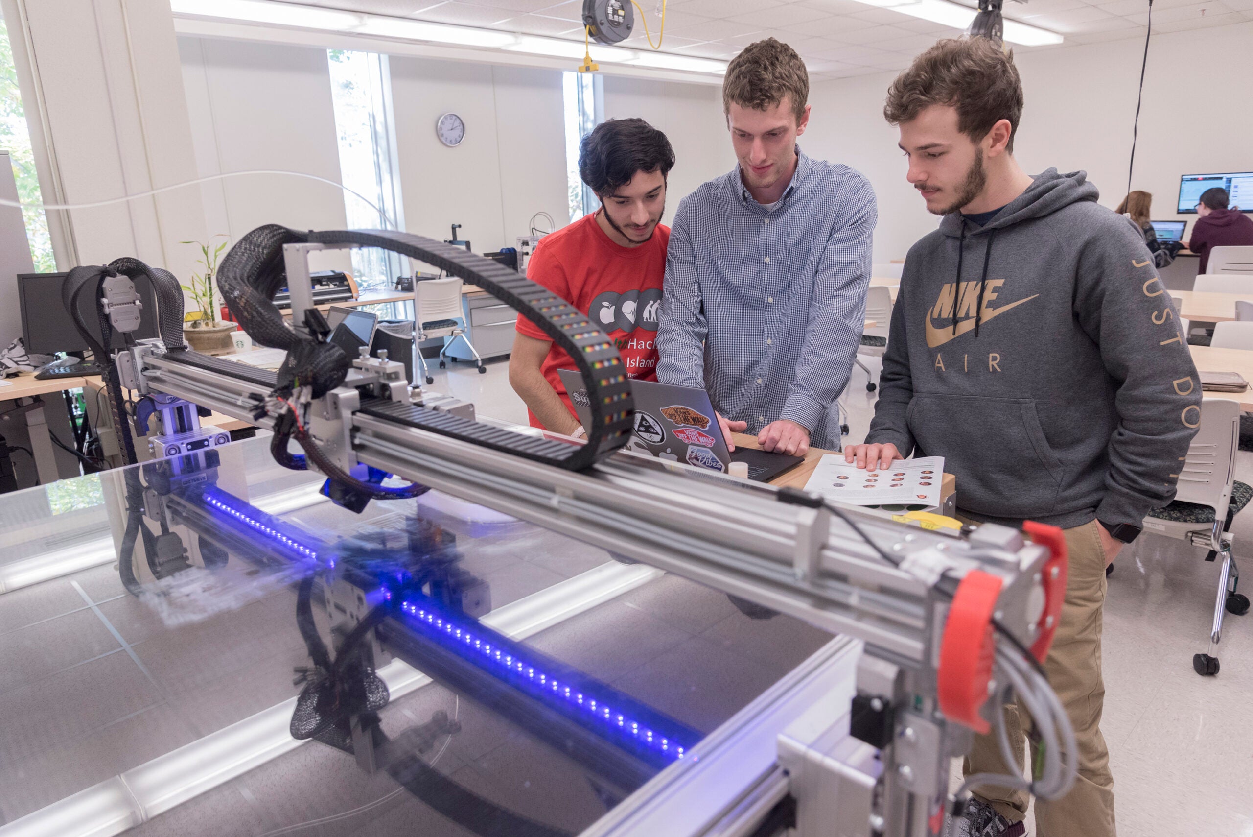 Students operating equipment for HealthHacks
