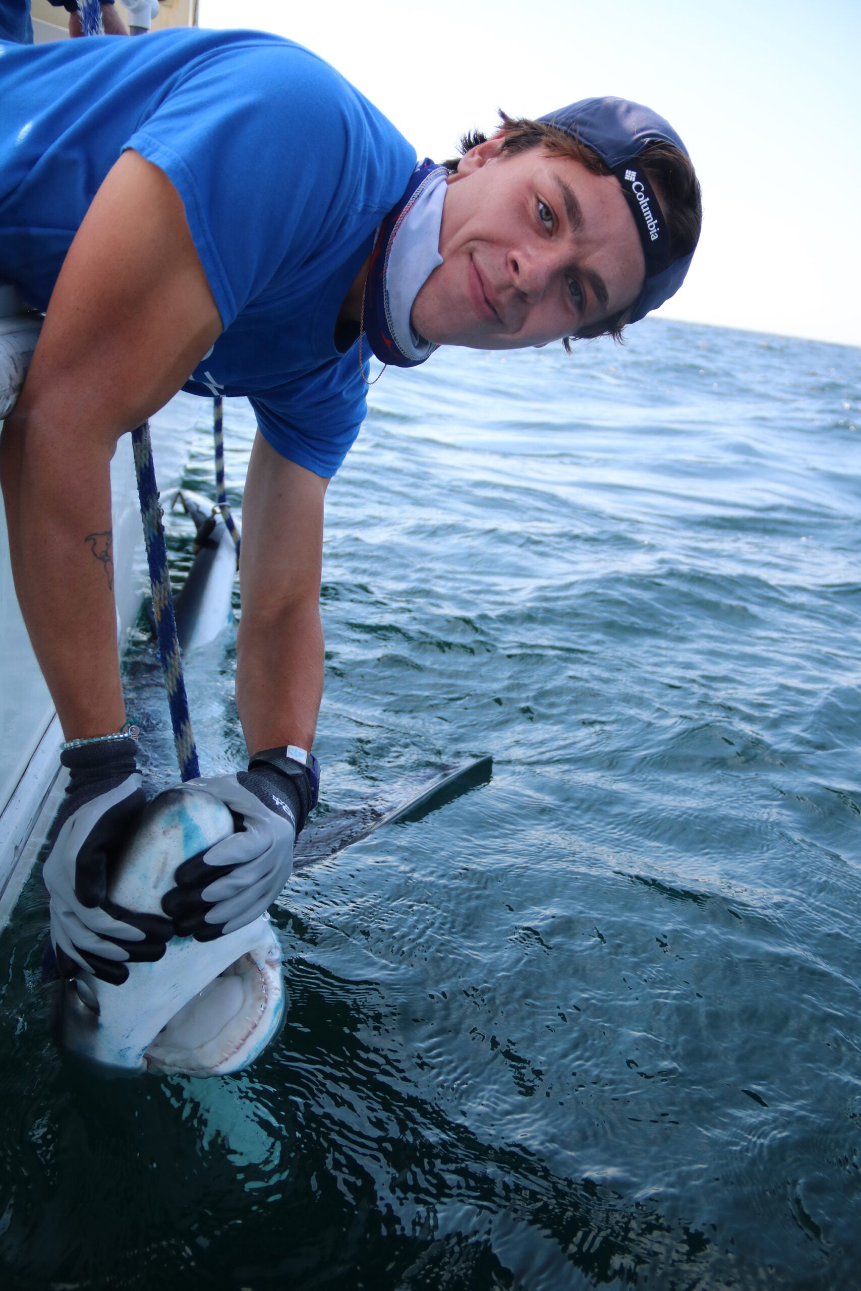 Colby Kresge holds a mako shark