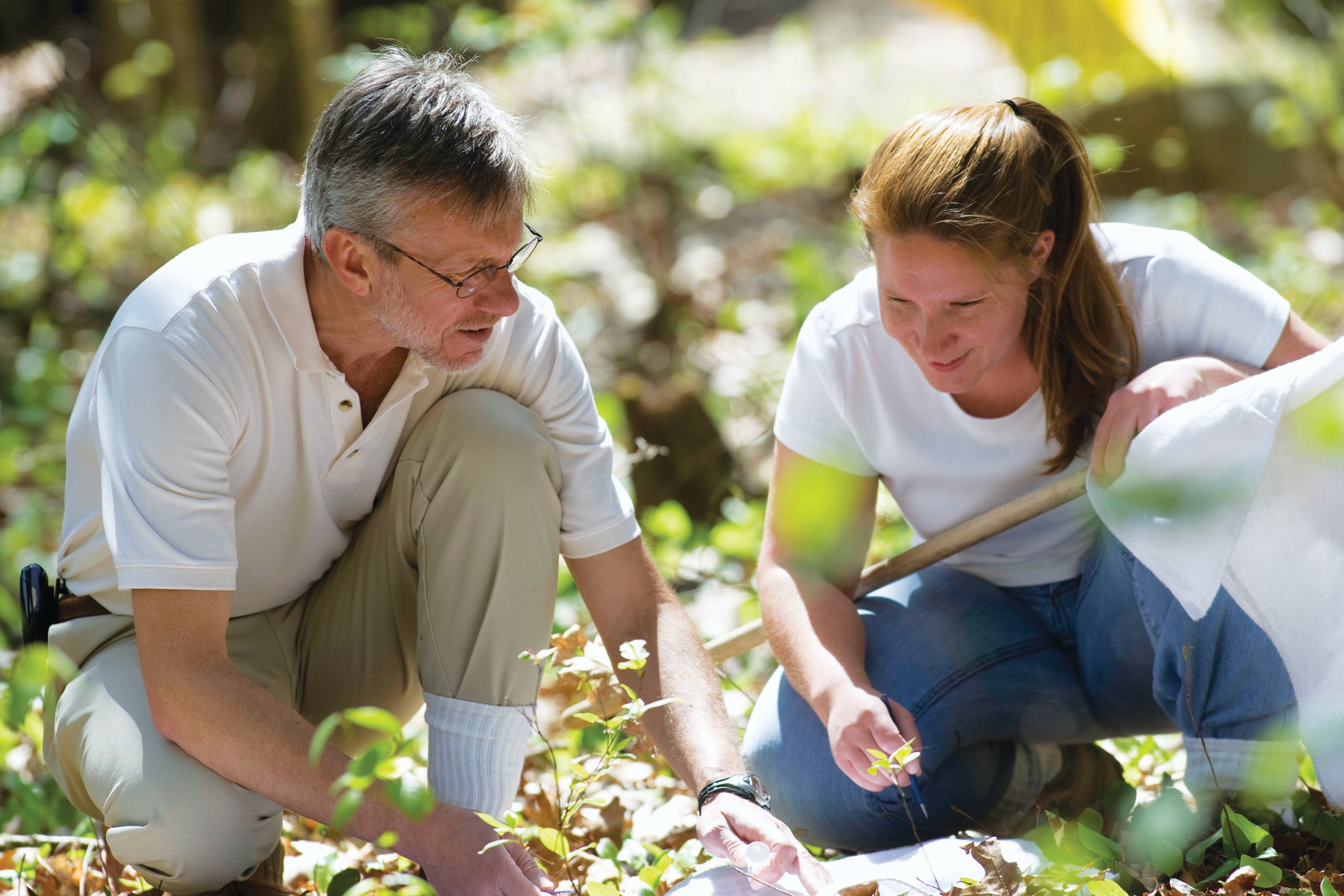 Tom Mather in the field with a student