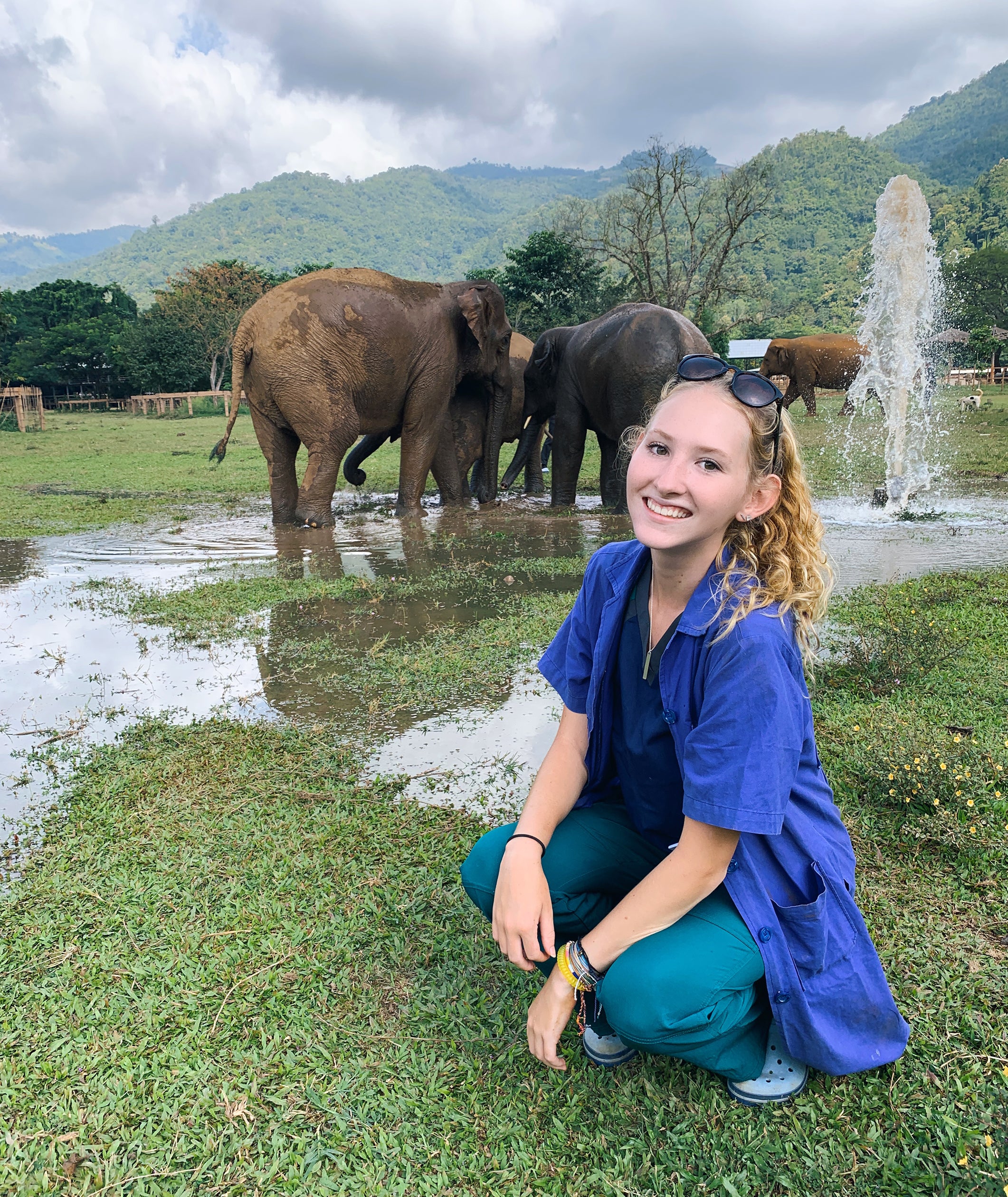 Sydney Page poses at an elephant sanctuary in Thailand