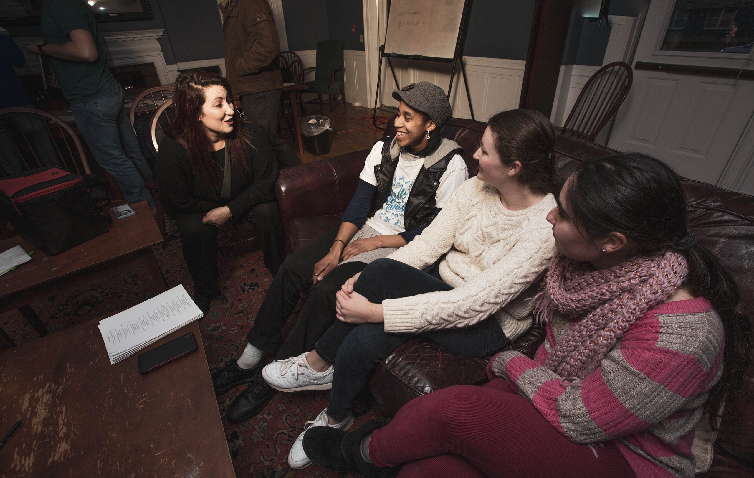 Students speak with a French professor