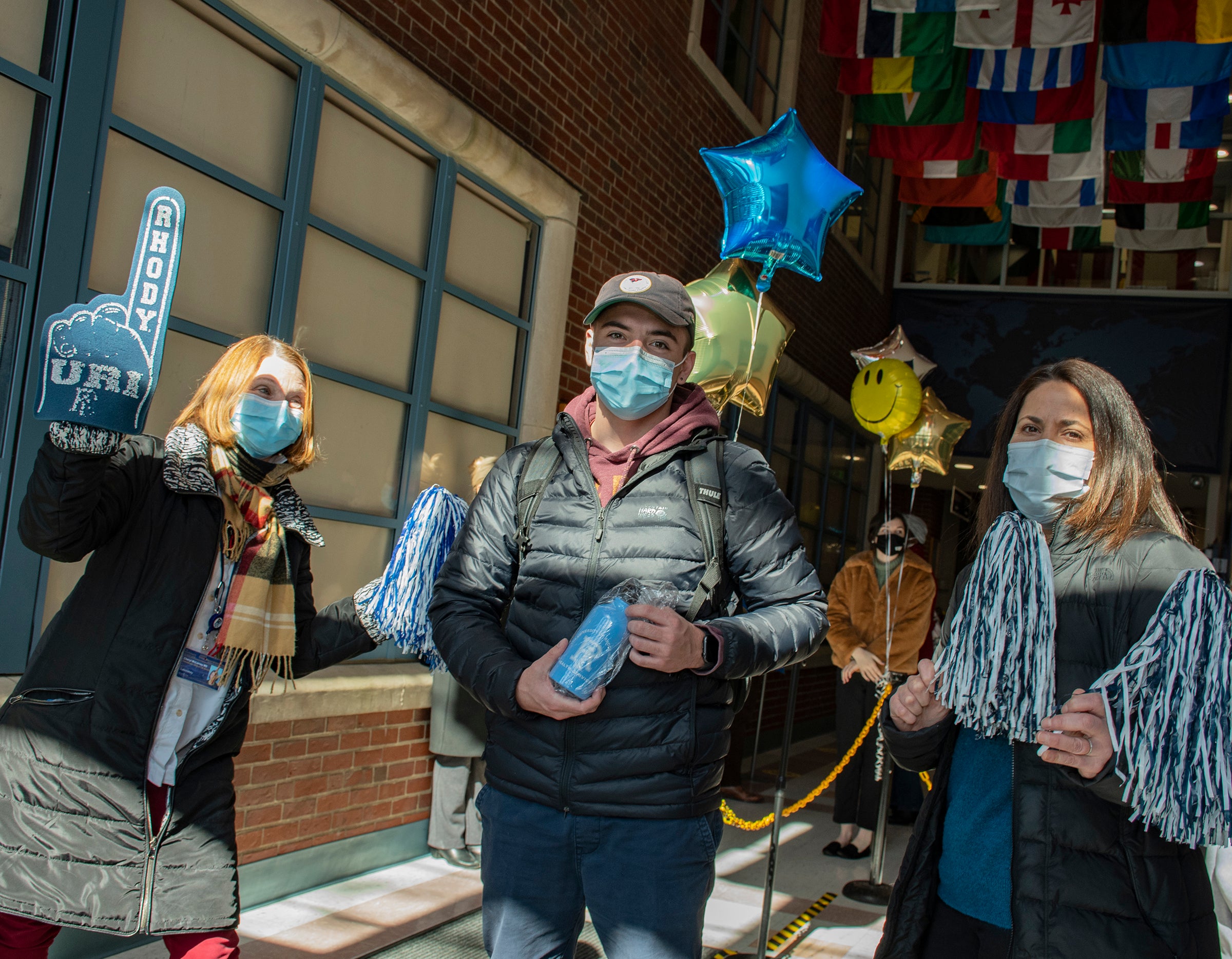 Jack Zmich, center, is cheered on by Cheryl McLarney, left, and Lindsey Amore