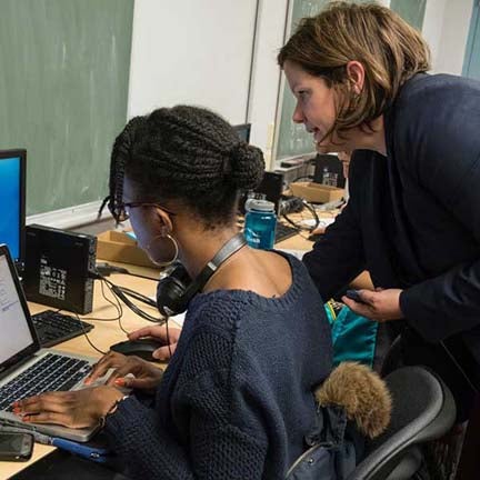 Michelle Flippin helps a student use LENA