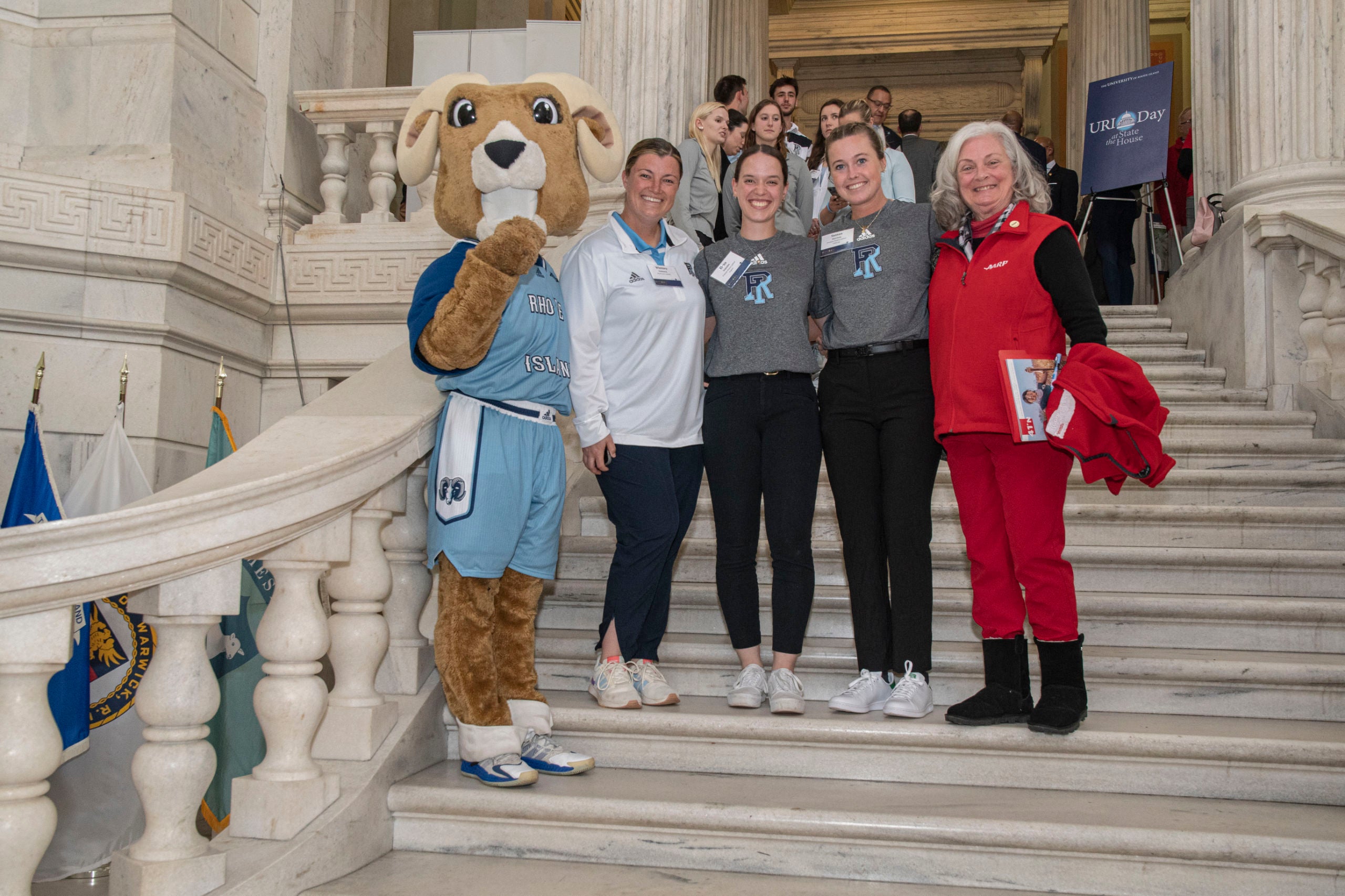 URI mascot Rhody the Ram poses with four people