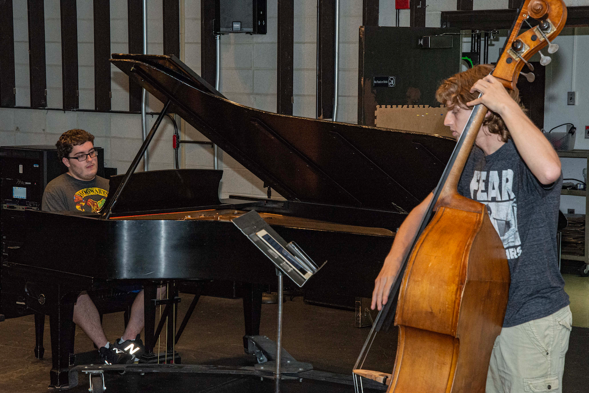Mason Tucker, left, and Wyatt Crosby rehearse for this weekend’s Newport Jazz Festival with other musicians from the URI jazz program. (URI Photo/Nora Lewis)