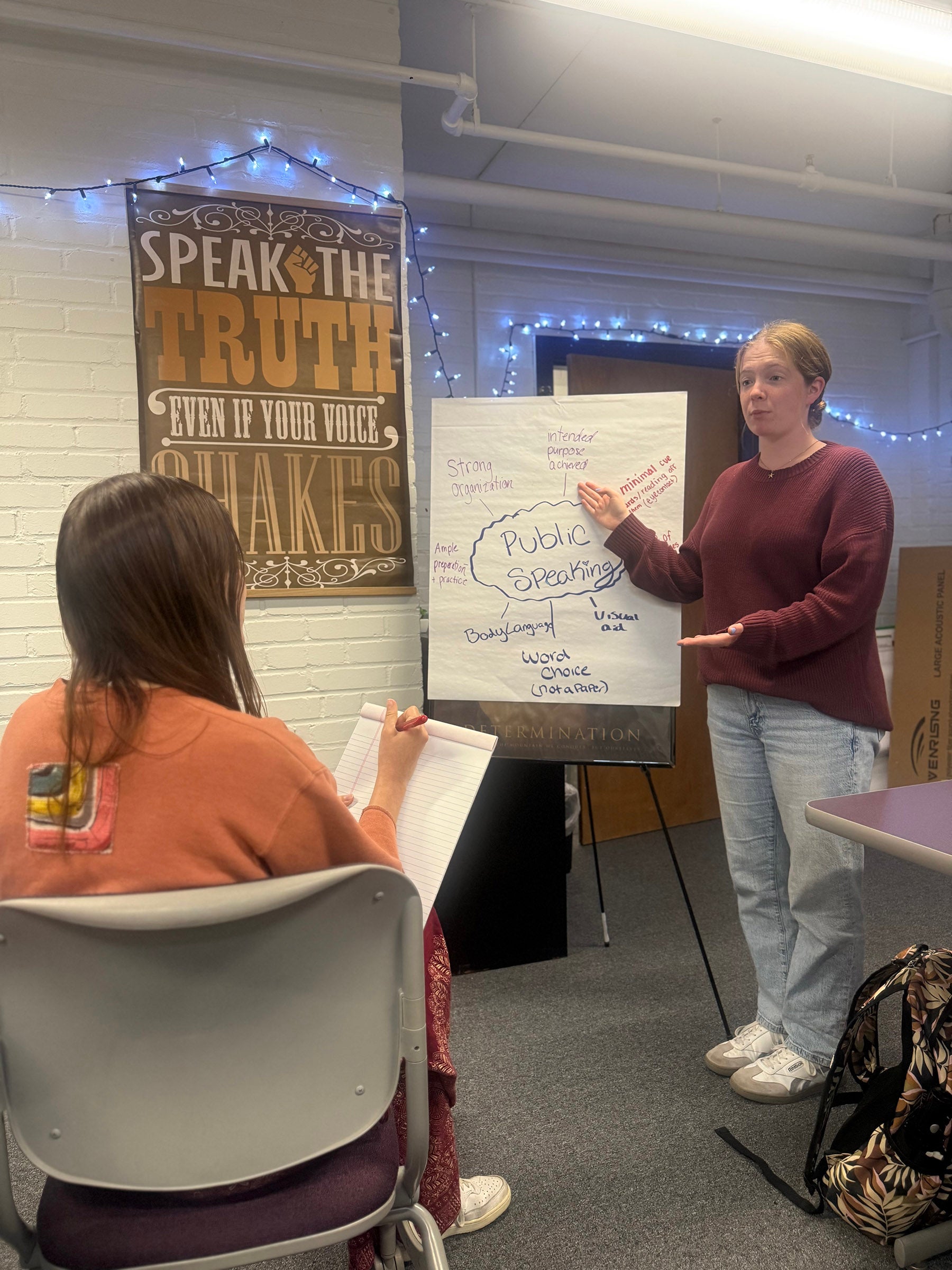 A student presents in the writing and speaking centers studio
