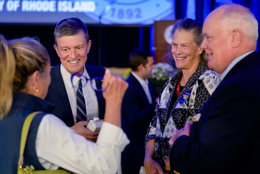 President Marc Parlange, left, his wife, Mary, and URI Trustee Joseph F. Matthews