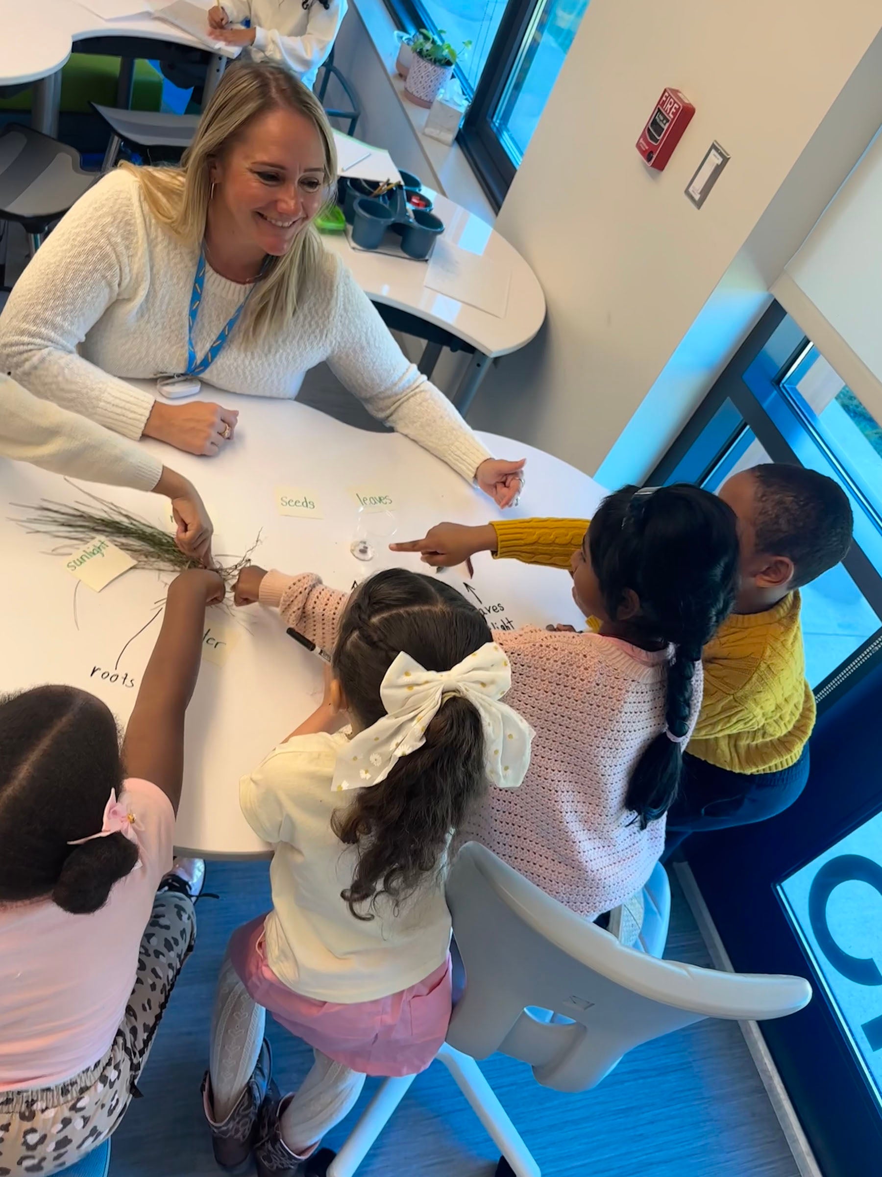 Toni Clifford M’26 at Garden City School in Cranston with students