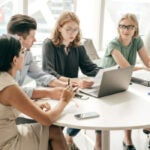 group of business professionals at a table
