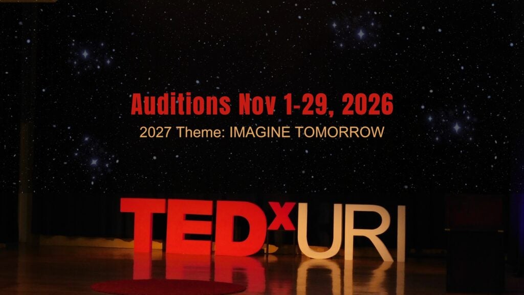 night sky background with TEDxURI in bold letters