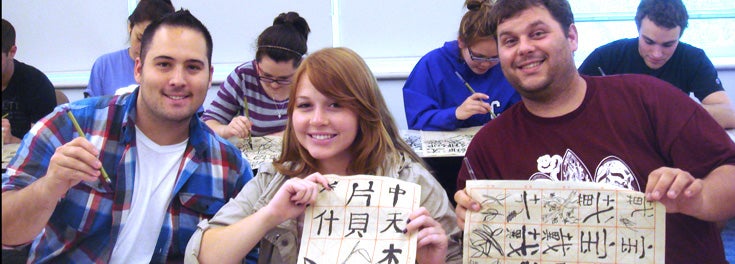 Students show Chinese characters