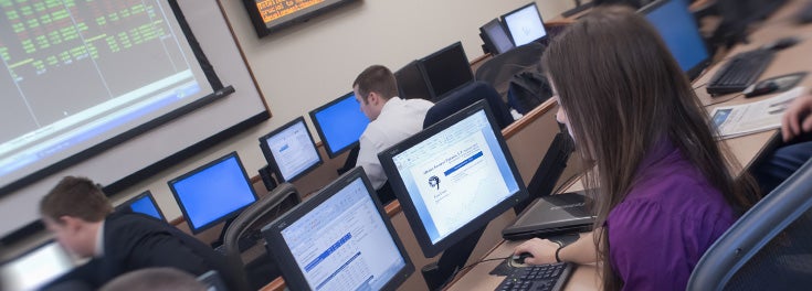 Students in the College of Business trading room.