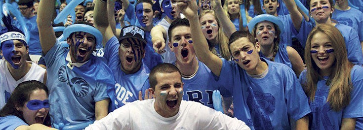Members of the Mob cheering at a URI basketball game