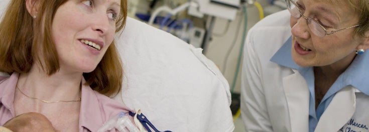 Discover the difference a few seconds make. Professor Judith Mercer with a new mom and baby at a local hospital
