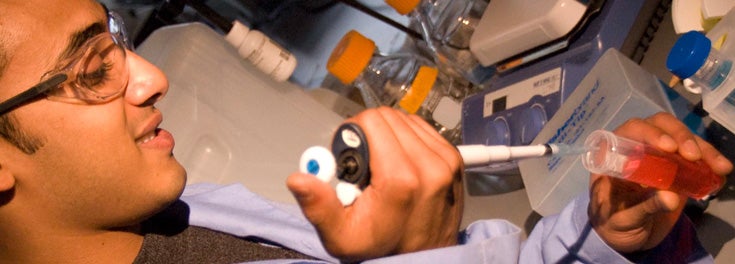 Anup Mohanty '11 working at a lab