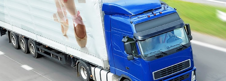 "Deliver the goods." Photo: 18-wheeler truck with a dancer in pointe shoes on the side. "Deliver the goods." Photo: 18-wheeler truck with a dancer in pointe shoes on the side.