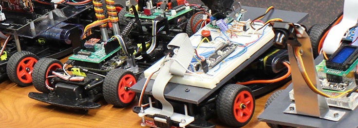 Even our cars are smart. Pictured: robotic cars built by URI students