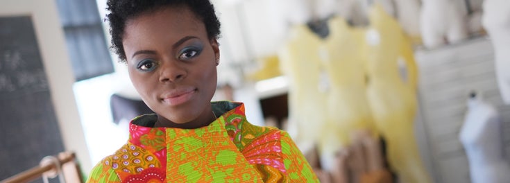 URI student modeling her own dress design