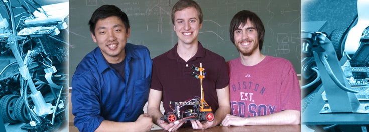 URI computer engineering students with their winning robotic car