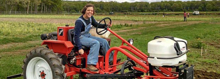 Girl riding on tractor