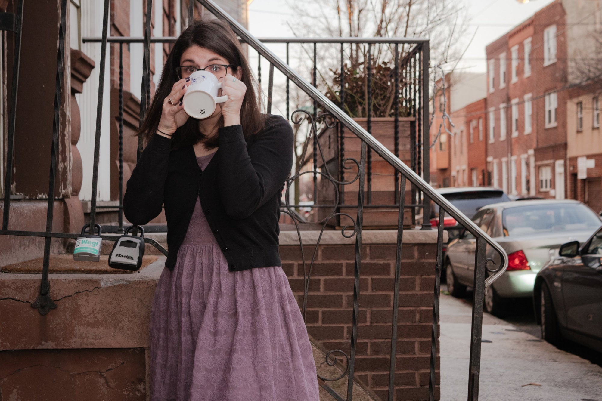 Hannah Travaglini '13 drinking from coffee mug