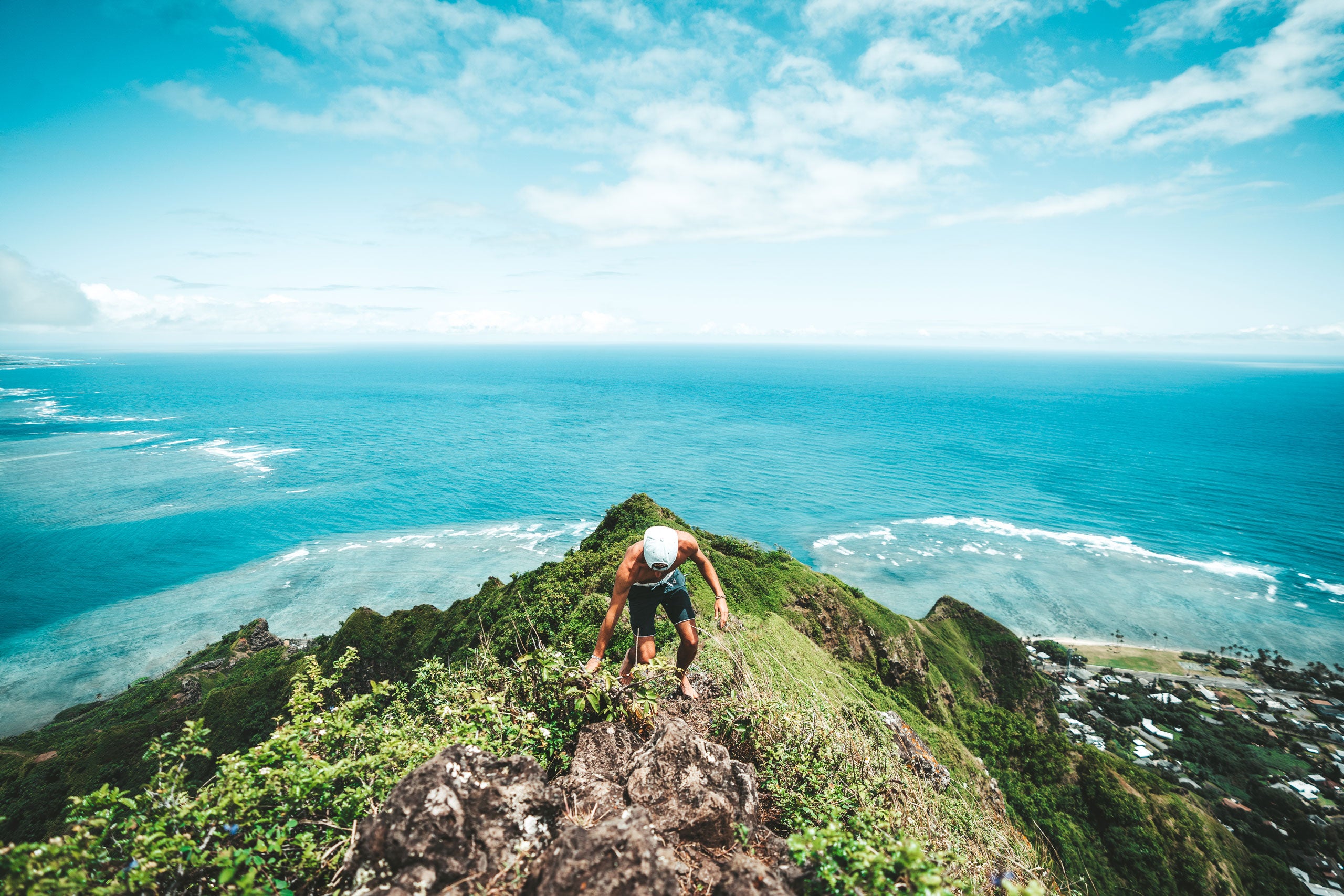 Corey Favino climbing a mountain trail in Oahu, Hawaii
