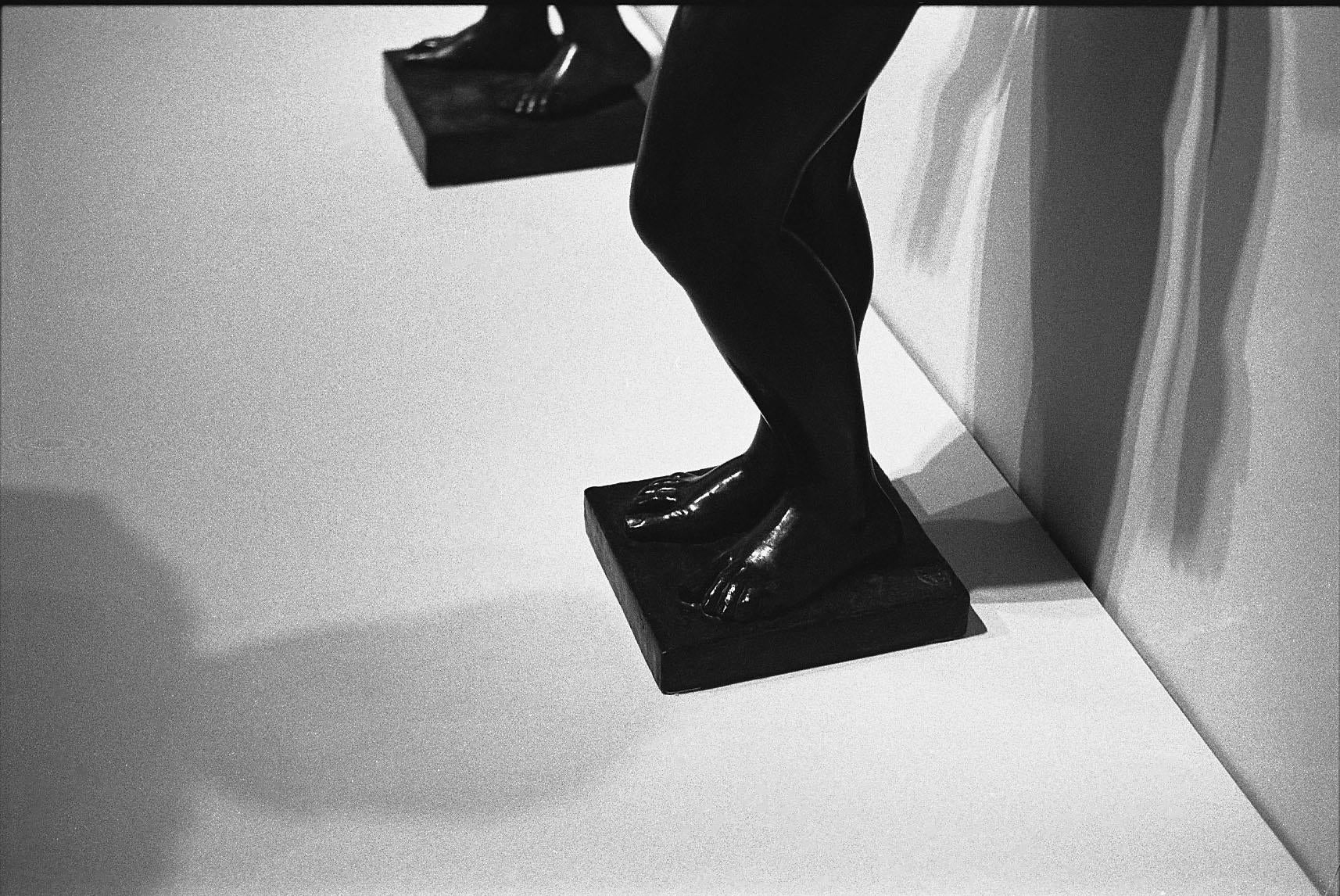 shadows cast by a sculpture of a female figure
