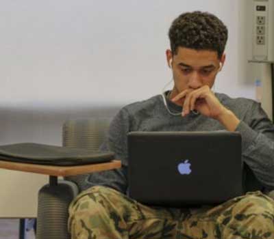 student working on a laptop