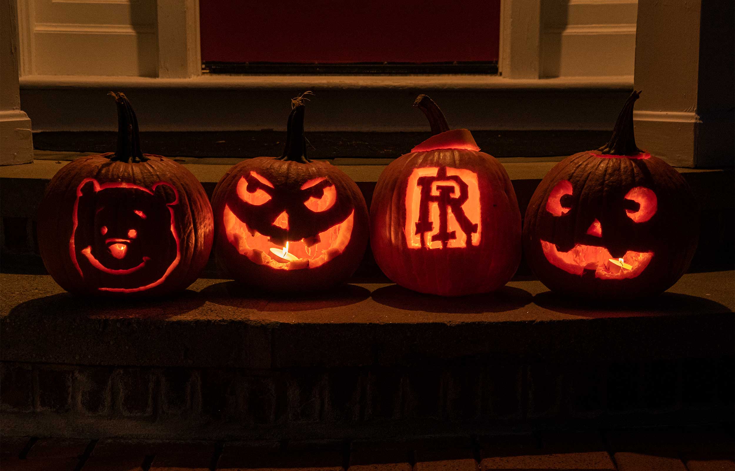 Carved pumpkins on the porch of URI Presidents house